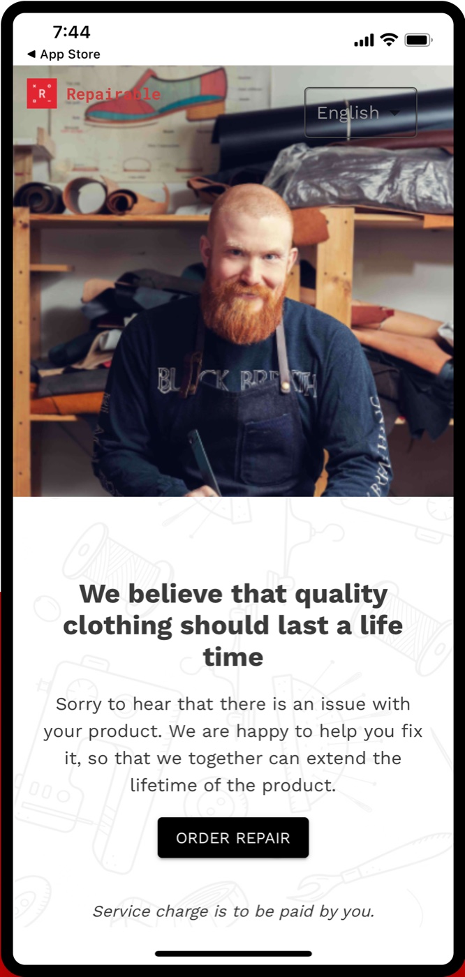 The original app landing screen: a workshop photo with the language switch laid over it